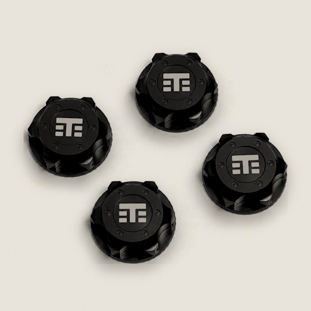 Wheel Nuts (T Logo 17mm serrated BLACK ano M12x1.0 4 pieces)